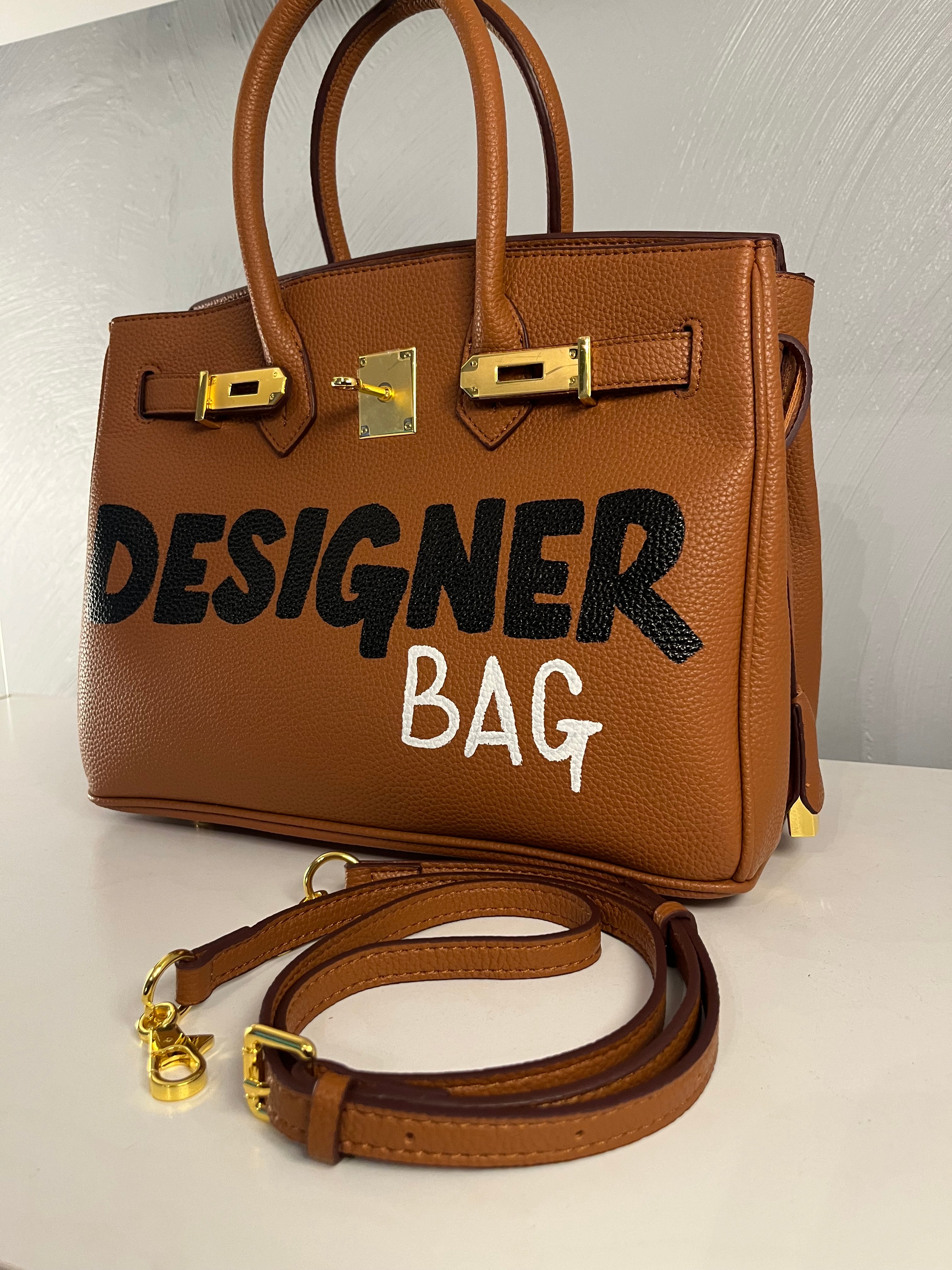 HER designer bag.