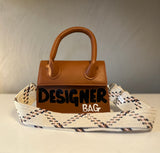 “Handle” it designer bag.